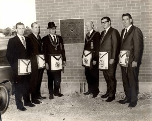 Leveling the Cornerstone: November 8, 1969: L-R; Mac Westbrook, JW; Harold Rodgers, WM; J. Guy Smith, GM; Claude Austin, PGM; Horace Groff, DDGM; and Bob Overturf, SW.